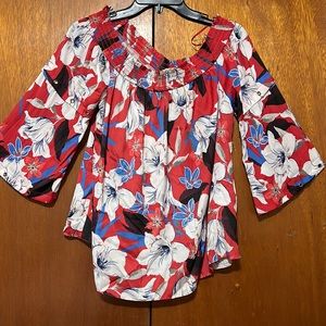 Red floral off the shoulder blouse.  100% Polyester.  Very comfortable to wear